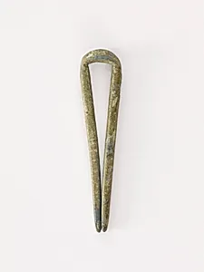 Topknot pin by Unknown