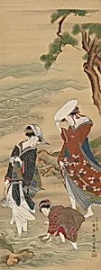 Two women and a girl on the seashore