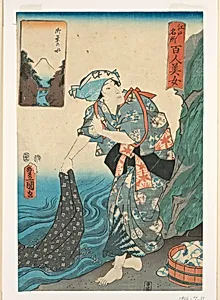 Woman washing fabric in a stream