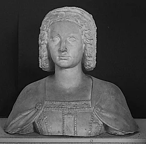 Buste fra gravstatue. Claude de France (-1524), Francois I's hustru, knælende i bøn. Dragt og hovedklæde er besat med ædelstene og kappen bærer mønster med den franske lilje by Ubekendt
