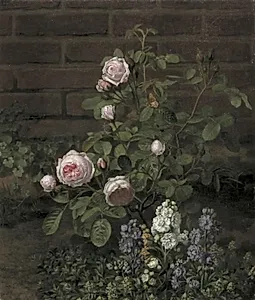 Et mosrosetræ omgivet af sommerblomster