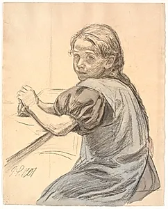 Georgia Skovgaard siddende ved et bord by Joakim Skovgaard