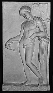 Gravrelief. Stående ung mand mod v. med fugl i h. hånd by Ubekendt