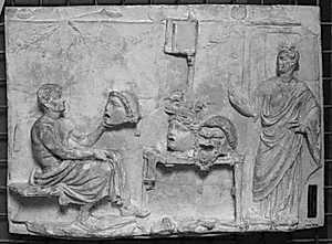 Komediedigteren Menander siddende mod h. med teatermasker, th. stående muse(?) by Ubekendt