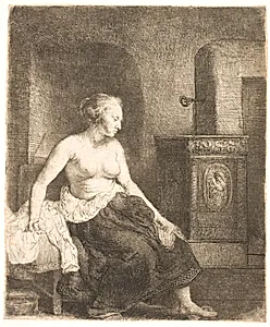 Kvindelig model, halvt påklædt, siddende ved en ovn by Rembrandt van Rijn