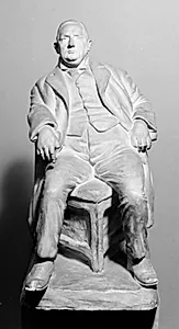 Redaktør Johannes Hansen, siddende i en stol by Kai Nielsen