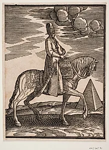 Rytter med drikkeflaske om halsen; profil t.h., et sværd langs højre side og baggage draperet om sadlens forreste del; i baggrunden t.h. en pyramide by Melchior Lorck