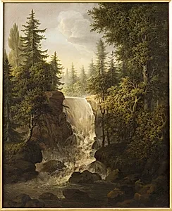 Skovrigt landskab med et vandfald