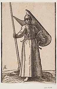 Stående soldat med hjelm på hovedet; i h. hånd en lanse, hvis top er udenfor øvre indramningslinje; på v. arm et krumt skjold, som ses indefra; i bæltet under h. arm en krum dolk, ved v. side et sværd by Melchior Lorck