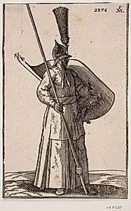 Stående soldat, vendt mod h.; på hovedet en spids hjelm med anselig fjerbusk; i h. hånd en lanse, hvis top er uden for øvre indramningslinje; på v. arm et skjold med indersiden vendt opad by Melchior Lorck