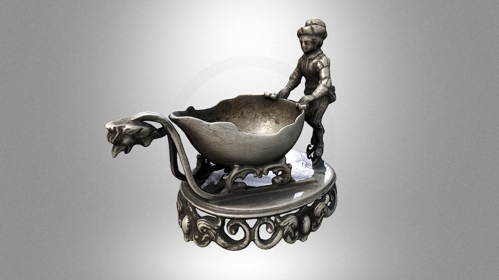 Silver salt cellar with a figure of a boy