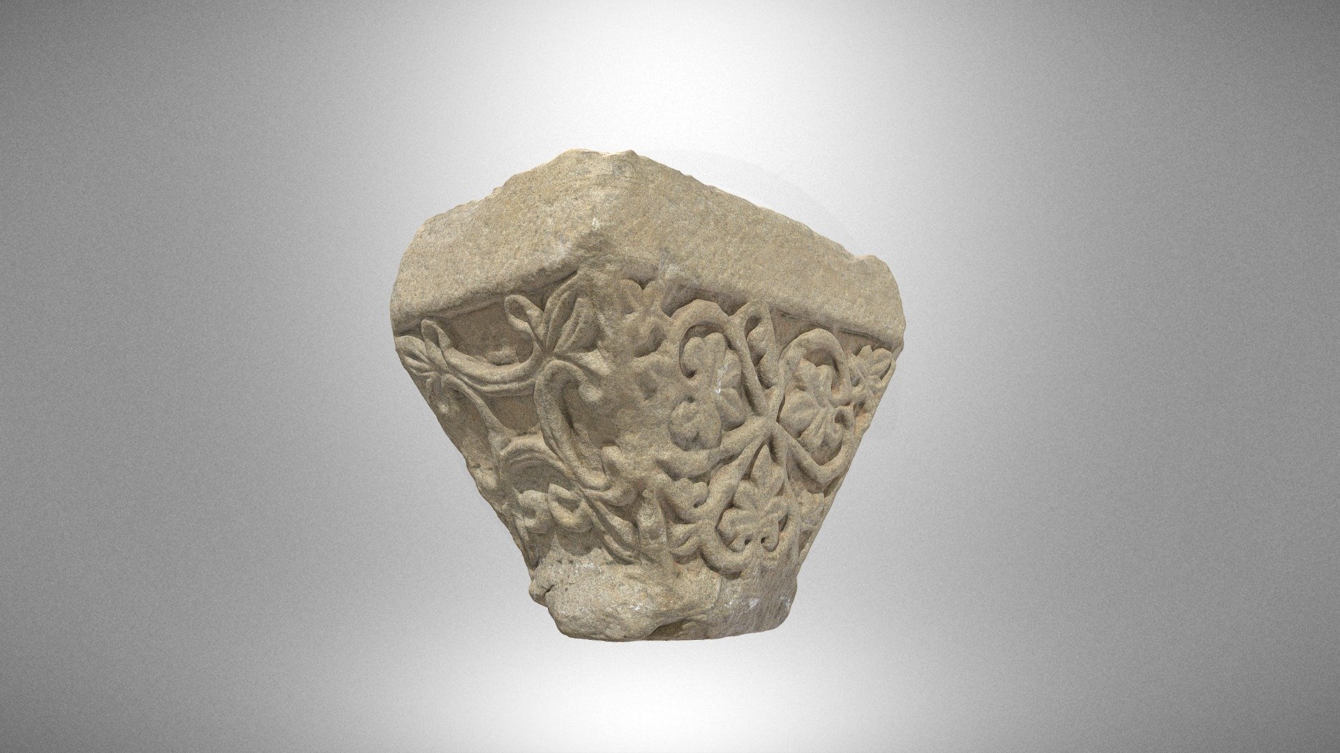 Half of a twin capital with a motif of hearts