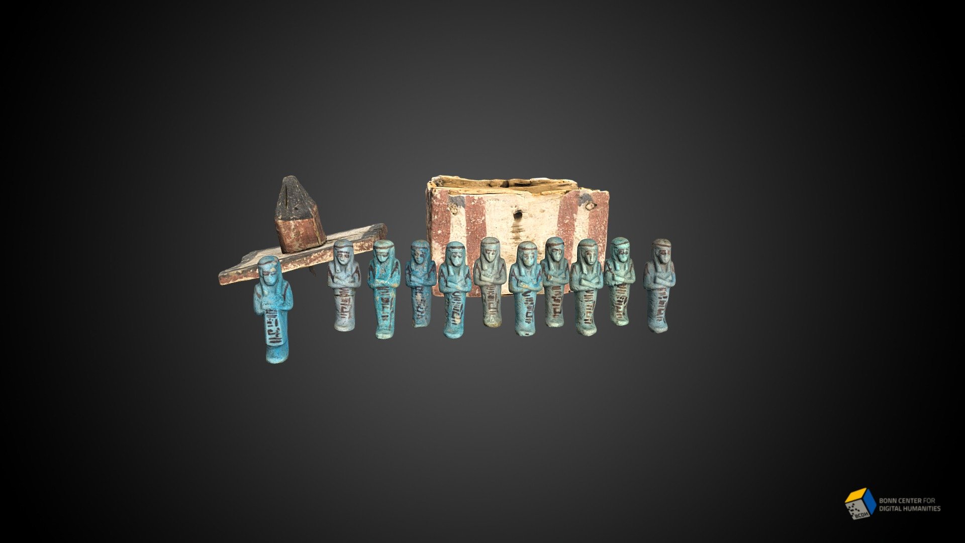 Small wooden chest with ushabti figurines inside