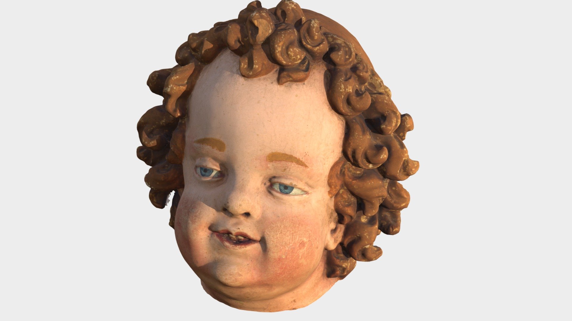 Angel head of carved wood and plaster