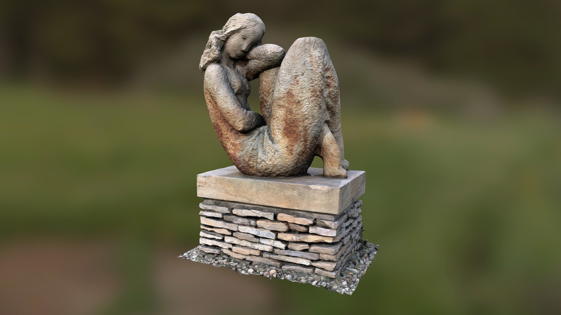 Statue of a seated girl