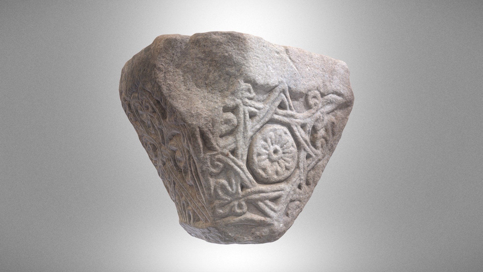 Half of a twin capital with a rosette motif