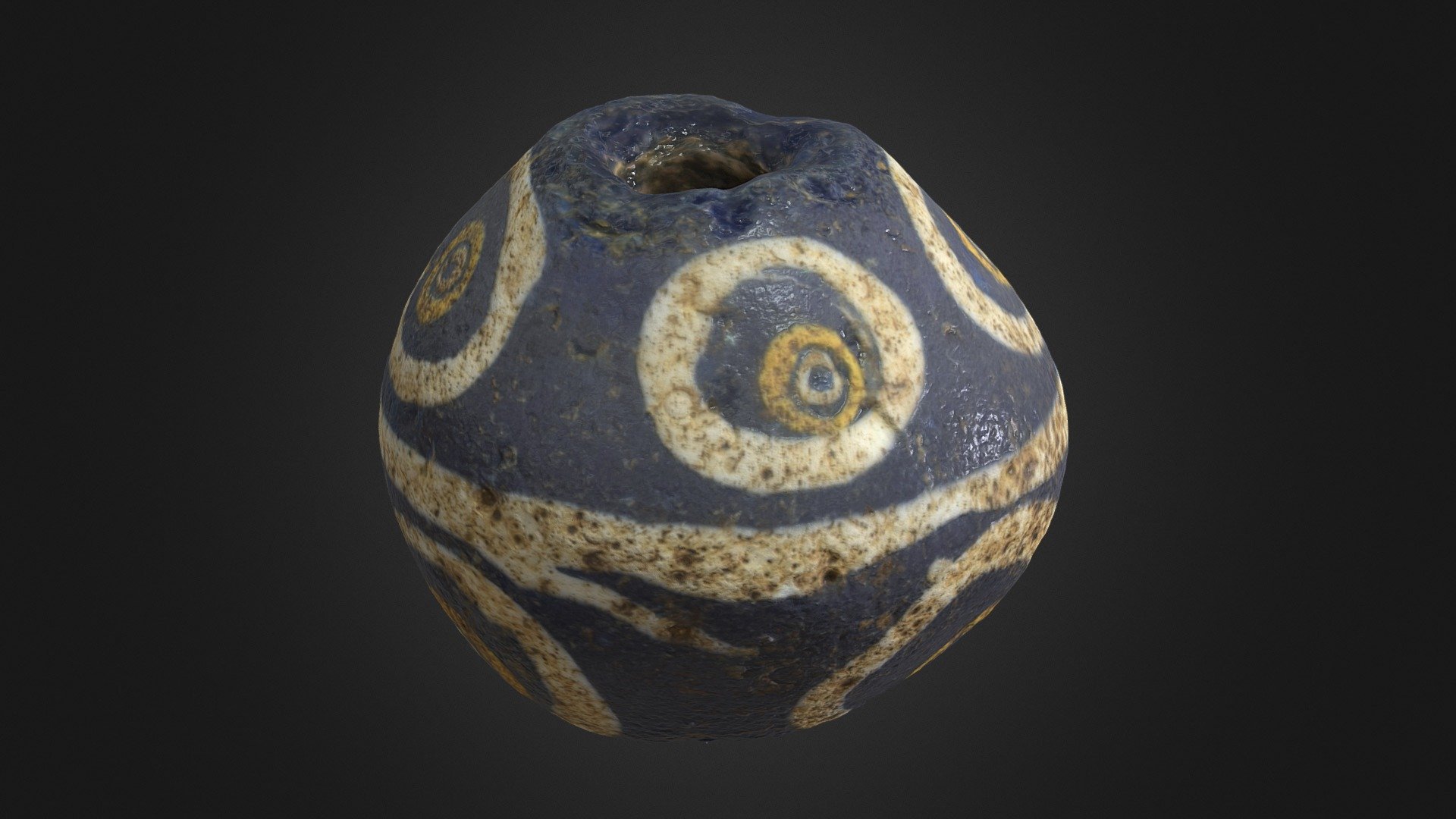 Blue glass bead with 'eye' decoration