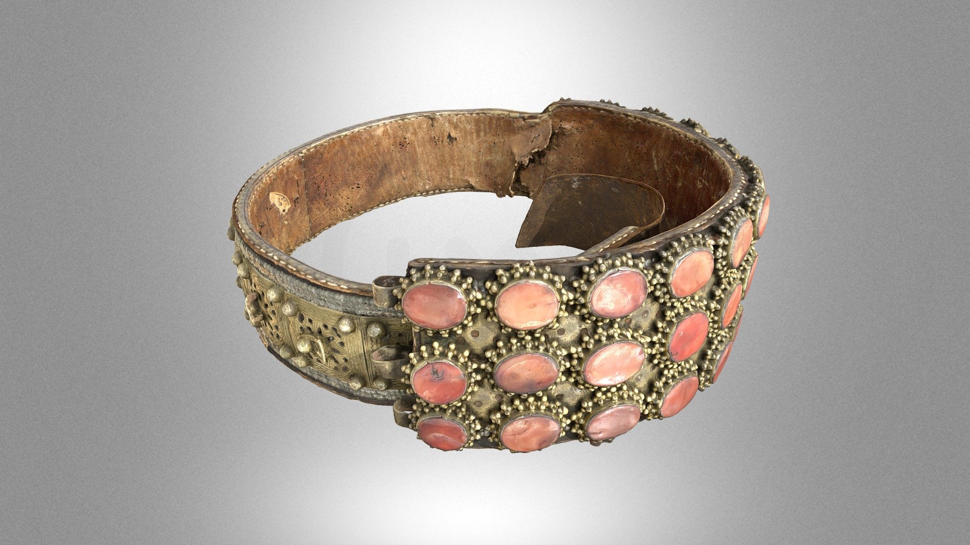 A leather belt decorated with metal ornaments